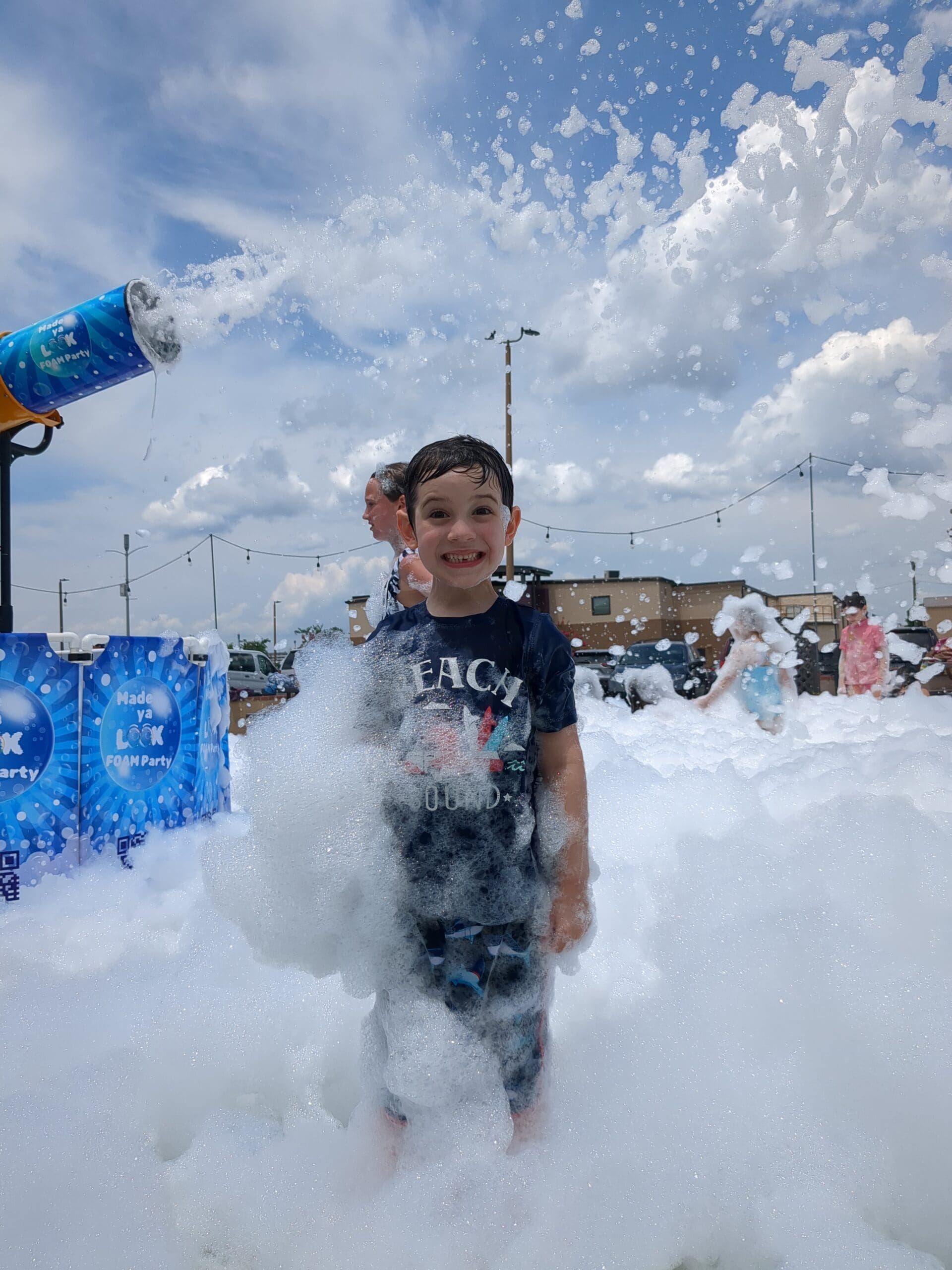 Foam party in Charlotte NC with kids playing in foam