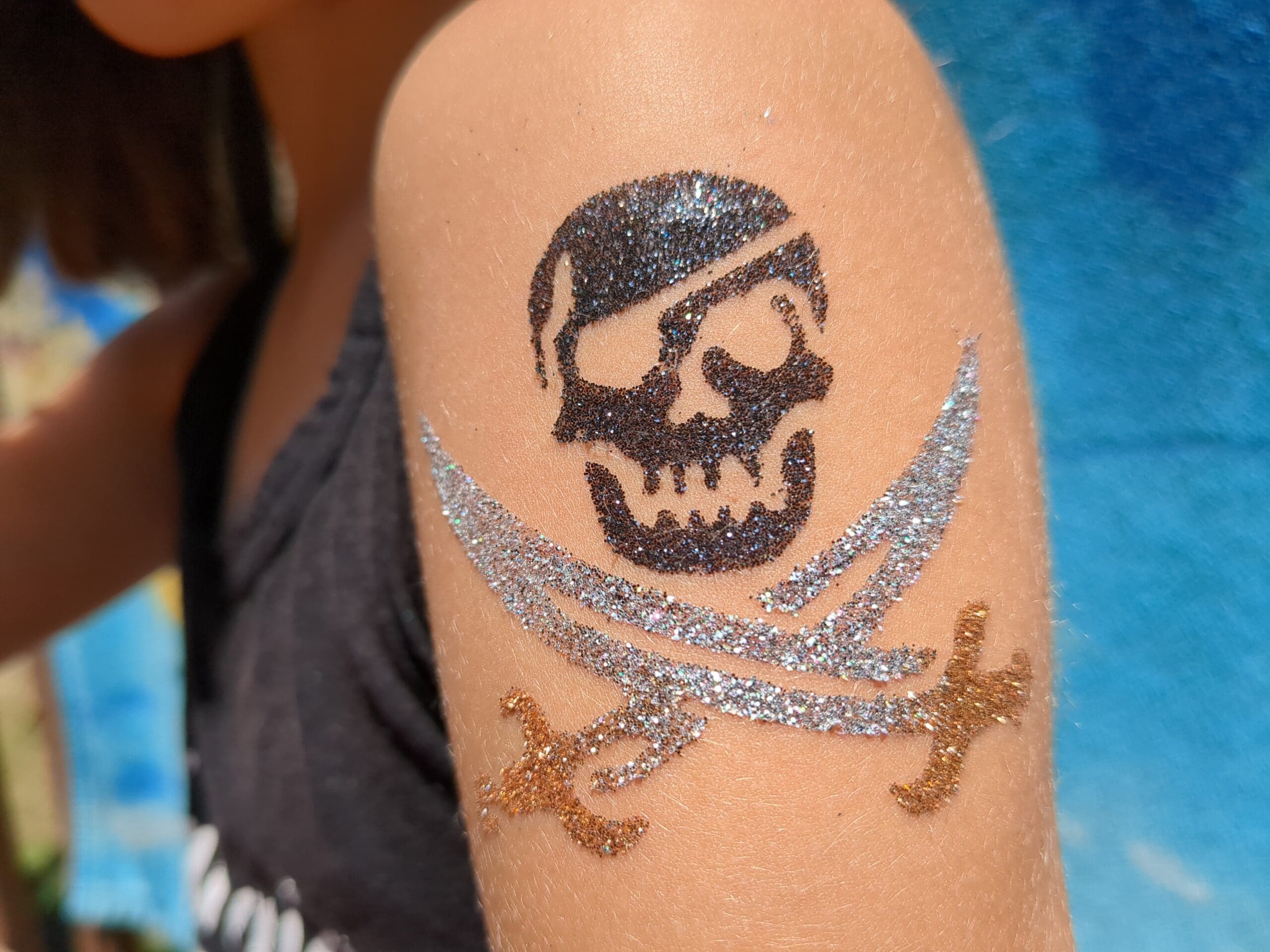 Pirate Glitter Tattoo - Made Ya Look Foam Party skull and crossbones glitter tattoo at a foam party in Ballantyne, nc