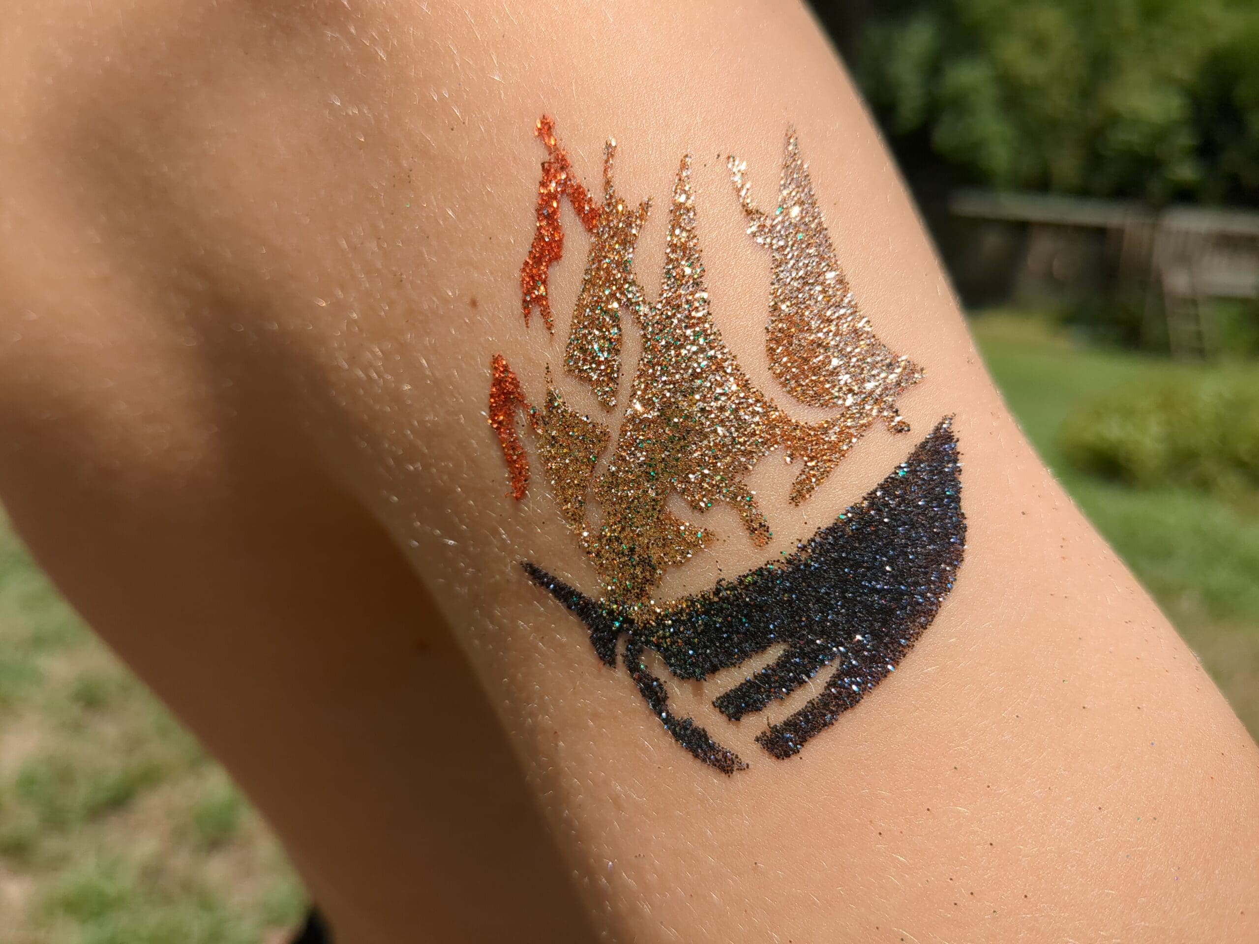 Pirate Ship Glitter Tattoo - Made Ya Look Foam Party pirate ship glitter tattoo on a shoulder at a glitter tattoo party