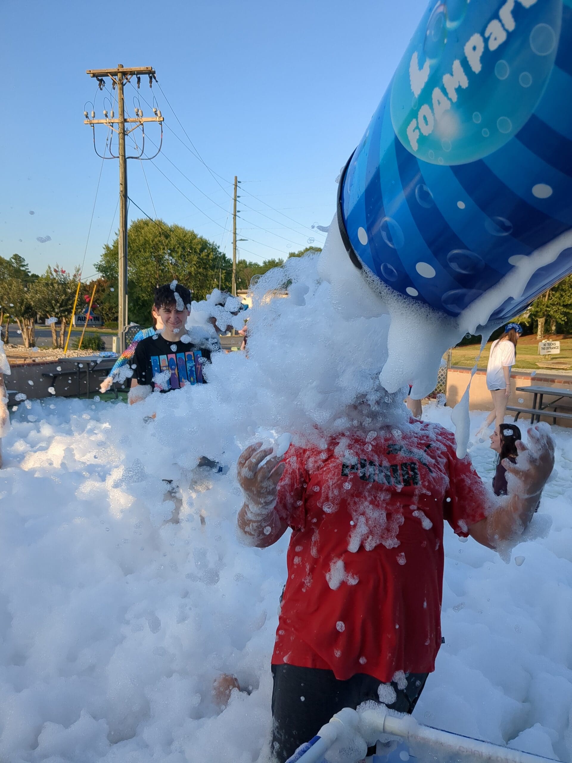 getting sprayed in the face by foam bubbles at a foam party