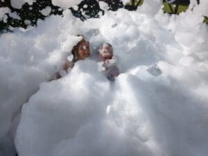 what not to wear to a foam party? Kids playing in a foam party pit.